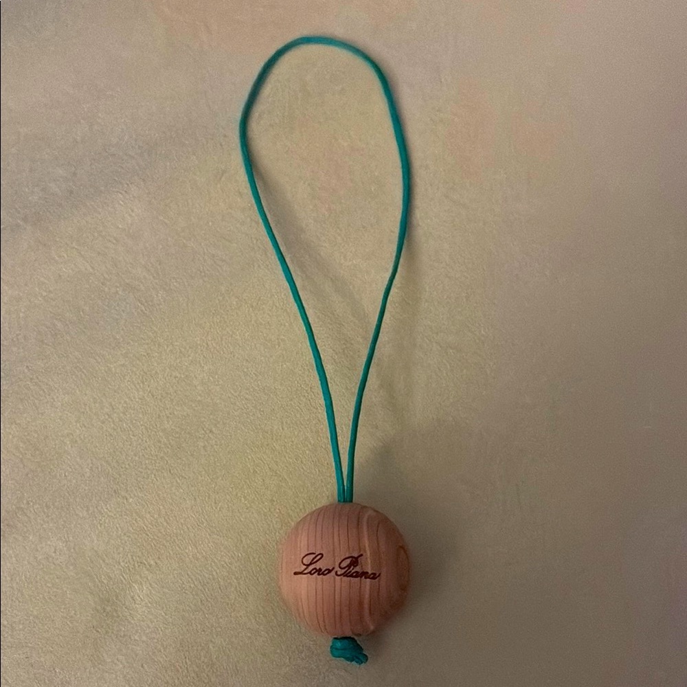 Loro Piana Wooden sphere with green  Cord